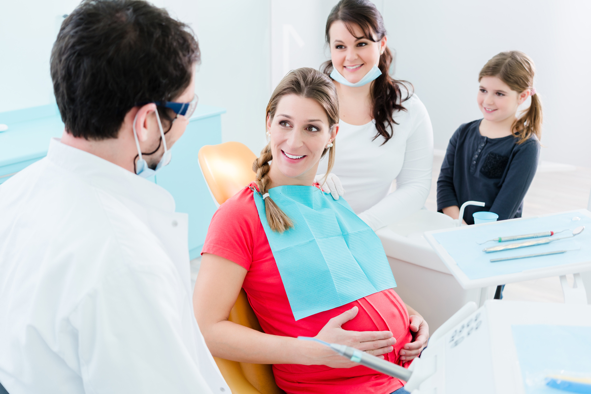 Pregnant woman at dentist before treatment