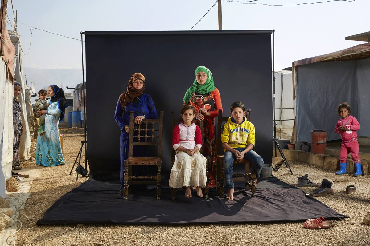 KHAWLE”S FAMILY - Bekaa Valley, Lebabnon  Khawle’s family arrived in the camp five months ago, leaving their grandmother, three brothers and two sisters in Syria.
While escaping from Syria, their bus was stopped and told to get out. They continued the rest of the journey on foot, but run into some IS fighters. 
One of Khawle’s daughters has a learning disabilty and IS targeted her. They beat her so badly that she couldn’t move for days.
“Perhaps we might stay like this for the rest of our lives”, says 44-year-old Khawle. “I don’t have anything to be happy for, just to live like this. I feel sad living here without all of my children”.