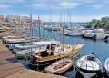 Stintino dock with boats and wooden boardwalk