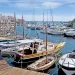 Stintino dock with boats and wooden boardwalk